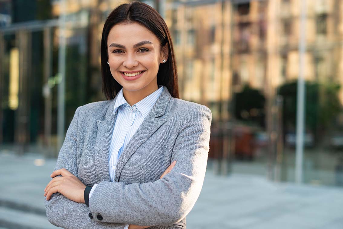 Close-up of business accountant using calculator while working i